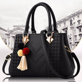 Black luxury women’s crossbody handbag with gold hardware